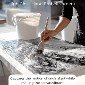 Artist applying high gloss hand embellishment to abstract canvas, enhancing depth and sheen